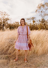 Load image into Gallery viewer, Pink floral midi dress on model

