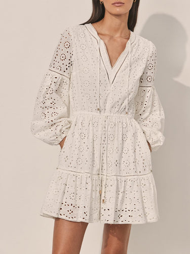 White detailed mini dress on model