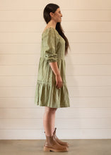 Load image into Gallery viewer, model wearing khaki tiered dress side shot
