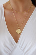 Load image into Gallery viewer, Gold amulet style necklace on model
