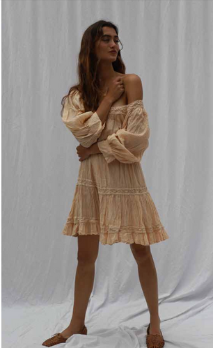 Model wearing almond mini dress