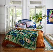 Load image into Gallery viewer, Throw with geometric green &amp; blue patterns on bed
