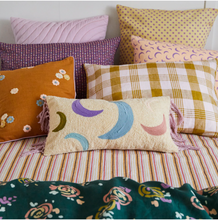 Load image into Gallery viewer, Coloured crescent moons fringe cushion style on bed
